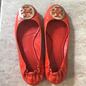 Gently used orange patent leather Tory Burch flats
